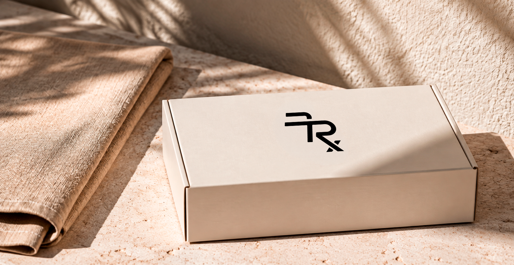A discreet Feelrx parcel resting on a stone bench in daylight